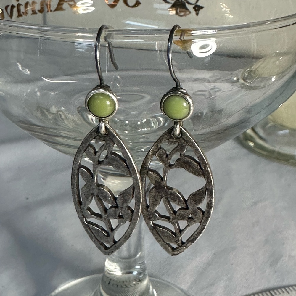 Silvertone floral motif drop style earrings